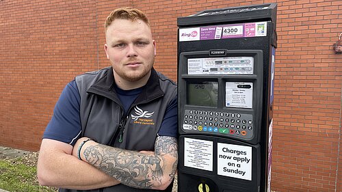 Connor happy next to Parking Meter