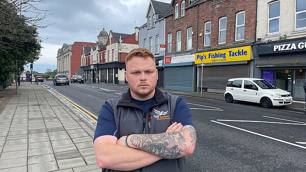 Connor Stallard infront of local shops in Hartlepool